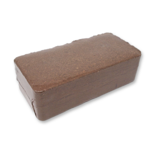 A compressed coir brick shrink-wrapped in plastic